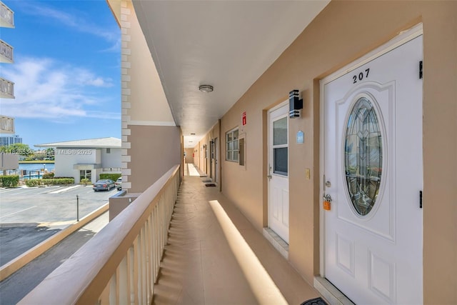 2097 S Ocean Unit 207, Hallandale Beach, FL 33009 - property entrance with a balcony and stucco siding