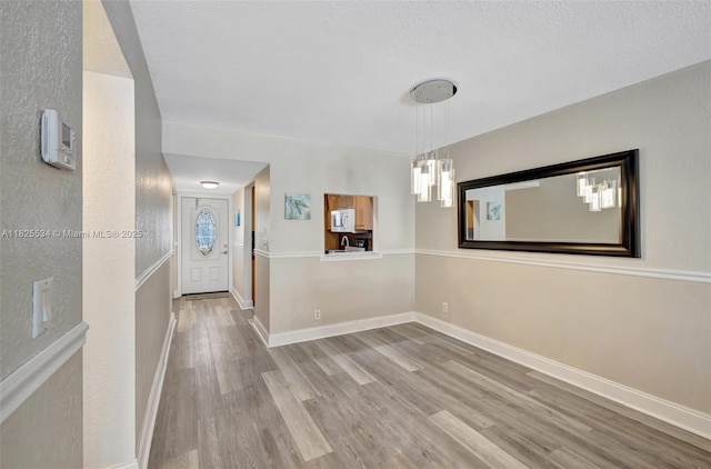 2097 S Ocean Unit 207, Hallandale Beach, FL 33009 - entryway featuring wood finished floors and a textured ceiling