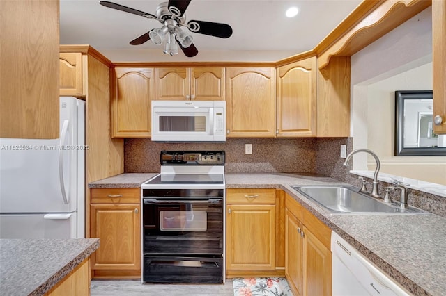 2097 S Ocean Unit 207, Hallandale Beach, FL 33009 - kitchen with white appliances, ceiling fan, light brown cabinets, and backsplash