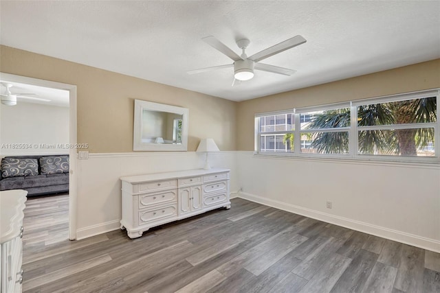 2097 S Ocean Unit 207, Hallandale Beach, FL 33009 - bedroom featuring dark wood-style flooring, ceiling fan, and a textured ceiling