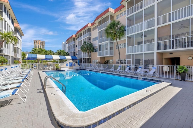 2097 S Ocean Unit 207, Hallandale Beach, FL 33009 - community pool with a ceiling fan and a patio