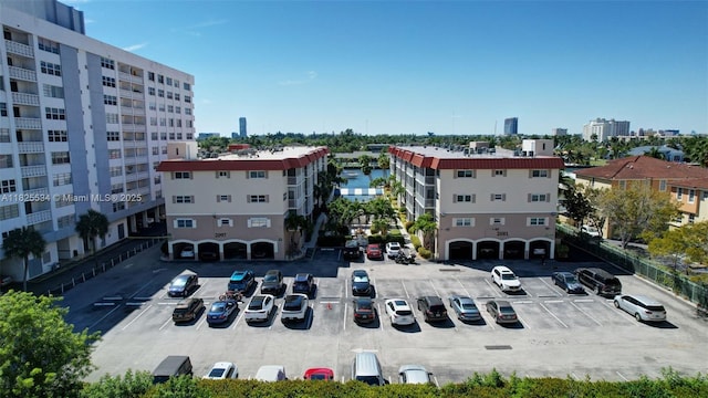 2097 S Ocean Unit 207, Hallandale Beach, FL 33009 - view of building exterior with uncovered parking and a city view