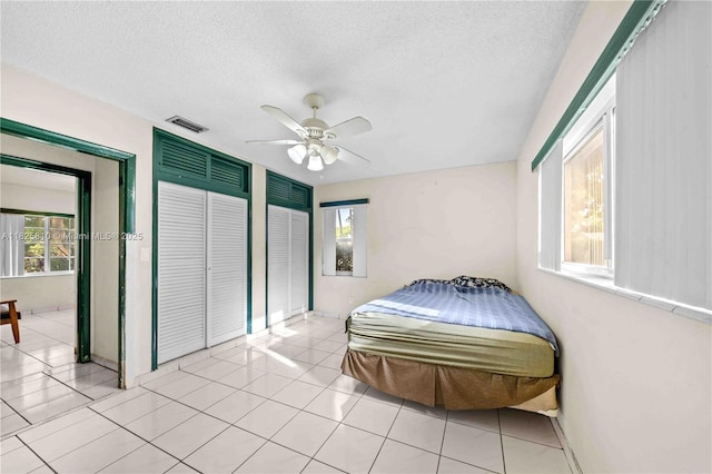 3820 SW 122nd Ave, Miami, FL 33175 - bedroom featuring a textured ceiling, a ceiling fan, and light tile patterned floors