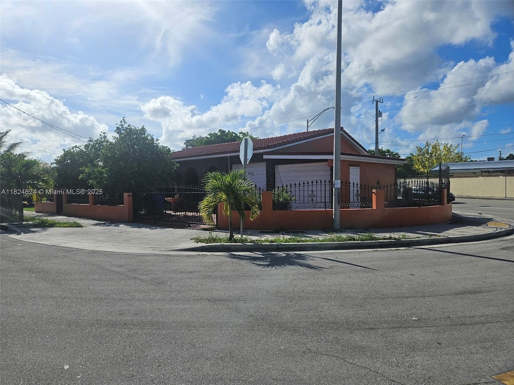 2327 SW 1st St, Miami, FL 33135 - ranch-style house featuring a fenced front yard, a gate, and stucco siding
