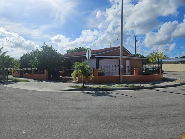 2327 SW 1st St, Miami, FL 33135 - ranch-style house featuring a fenced front yard, a gate, and stucco siding
