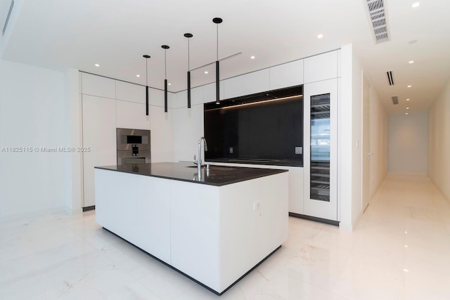 300 Biscayne Blvd Way Unit 3902, Miami, FL 33131 - kitchen with modern cabinets, dark countertops, white cabinetry, wine cooler, and recessed lighting
