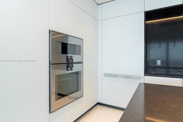 300 Biscayne Blvd Way Unit 3902, Miami, FL 33131 - kitchen with white cabinetry, appliances with stainless steel finishes, modern cabinets, and dark stone counters
