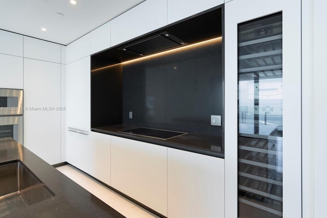 300 Biscayne Blvd Way Unit 3902, Miami, FL 33131 - kitchen with beverage cooler, modern cabinets, dark countertops, white cabinets, and stainless steel microwave