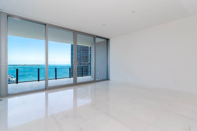 300 Biscayne Blvd Way Unit 3902, Miami, FL 33131 - spare room featuring expansive windows, a water view, and tile patterned flooring