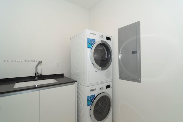 300 Biscayne Blvd Way Unit 3902, Miami, FL 33131 - laundry area featuring stacked washer / drying machine, electric panel, and cabinet space