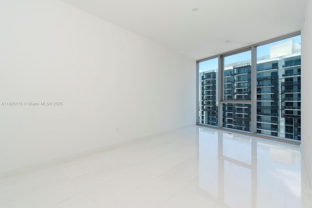 300 Biscayne Blvd Way Unit 3902, Miami, FL 33131 - spare room with floor to ceiling windows and tile patterned flooring