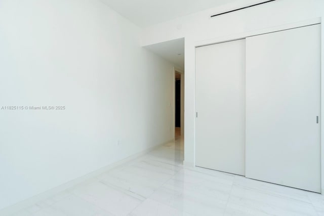 300 Biscayne Blvd Way Unit 3902, Miami, FL 33131 - unfurnished bedroom featuring a closet and light marble finish floors
