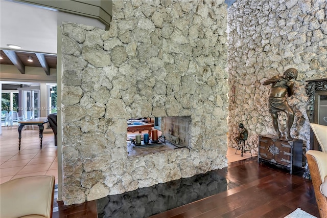 2691 SW 110th Way, Davie, FL 33328 - unfurnished living room with beamed ceiling and hardwood / wood-style flooring