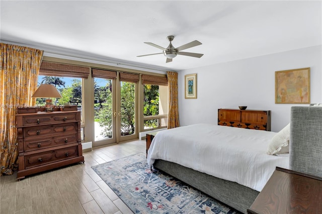 2691 SW 110th Way, Davie, FL 33328 - bedroom with access to exterior, wood finished floors, and ceiling fan