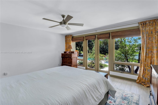 2691 SW 110th Way, Davie, FL 33328 - bedroom with light wood-style flooring and a ceiling fan