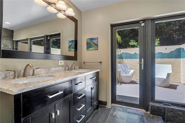 2691 SW 110th Way, Davie, FL 33328 - full bathroom featuring double vanity and stone finish flooring