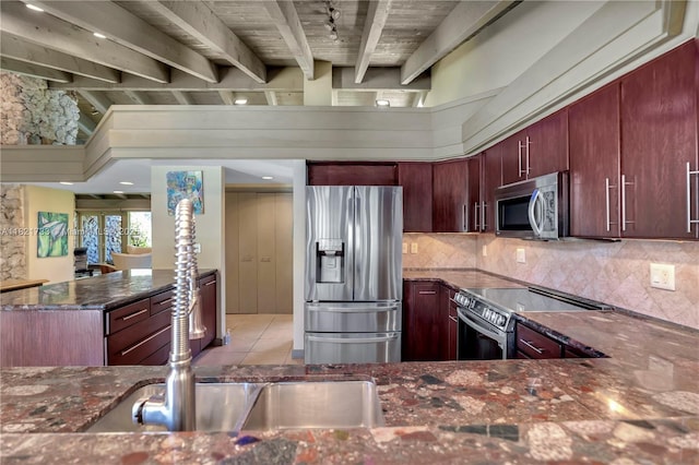 2691 SW 110th Way, Davie, FL 33328 - kitchen featuring stainless steel appliances, beamed ceiling, dark stone counters, tasteful backsplash, and light tile patterned floors