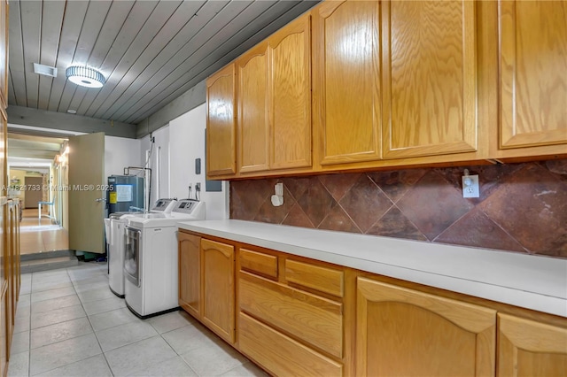 2691 SW 110th Way, Davie, FL 33328 - washroom with washing machine and dryer, cabinet space, water heater, and light tile patterned floors