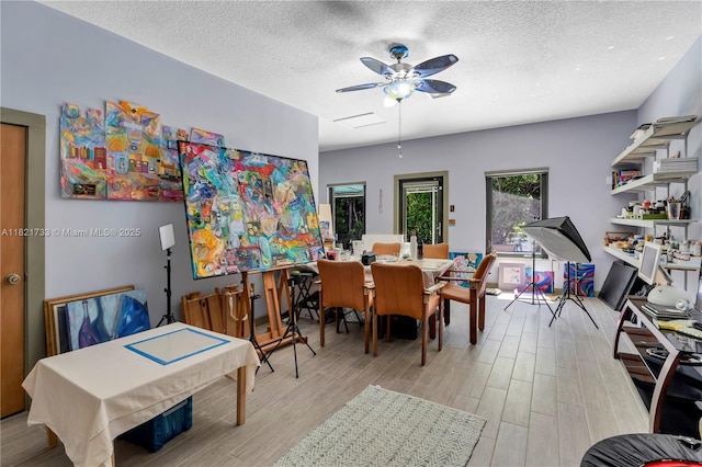 2691 SW 110th Way, Davie, FL 33328 - dining area featuring a ceiling fan, light wood finished floors, a textured ceiling, and attic access