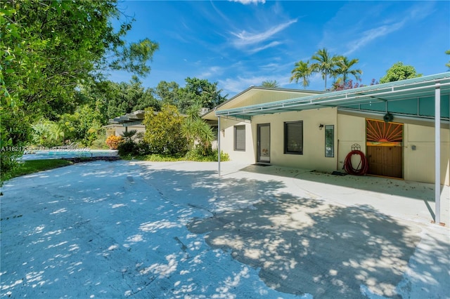 2691 SW 110th Way, Davie, FL 33328 - rear view of house featuring a pool and stucco siding