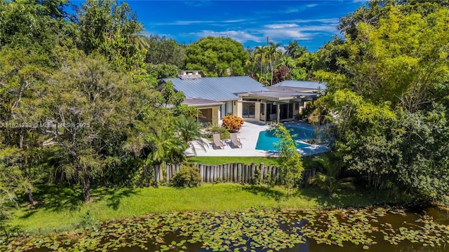 2691 SW 110th Way, Davie, FL 33328 - back of house with a patio, a fenced backyard, a metal roof, and a standing seam roof