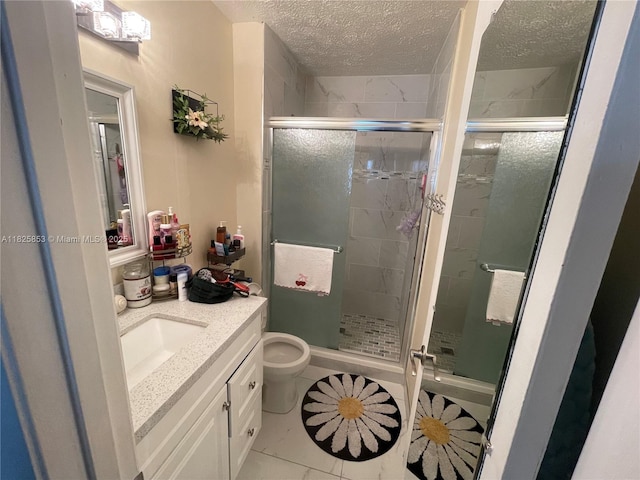 1716 SW Cordova St, Port St Lucie, FL 34987 - bathroom with a textured ceiling, vanity, a shower stall, and tile patterned flooring