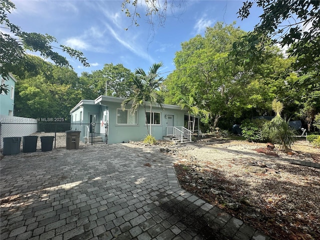 349 Mahogany Dr, Key Largo, FL 33037 - view of front of property featuring a gate and stucco siding