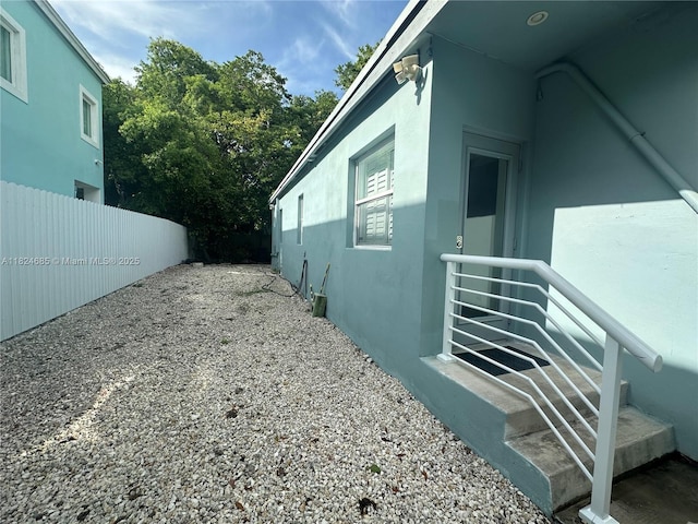 349 Mahogany Dr, Key Largo, FL 33037 - view of side of home featuring stucco siding