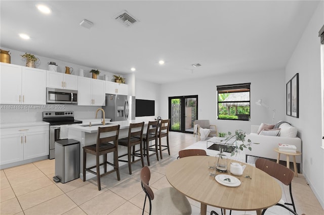 25041 SW 108th Ave, Homestead, FL 33032 - dining room featuring light tile patterned flooring and recessed lighting