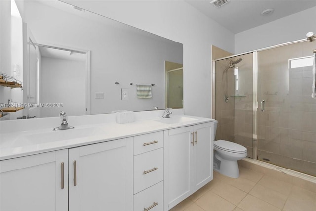 25041 SW 108th Ave, Homestead, FL 33032 - bathroom featuring double vanity, a stall shower, and tile patterned floors