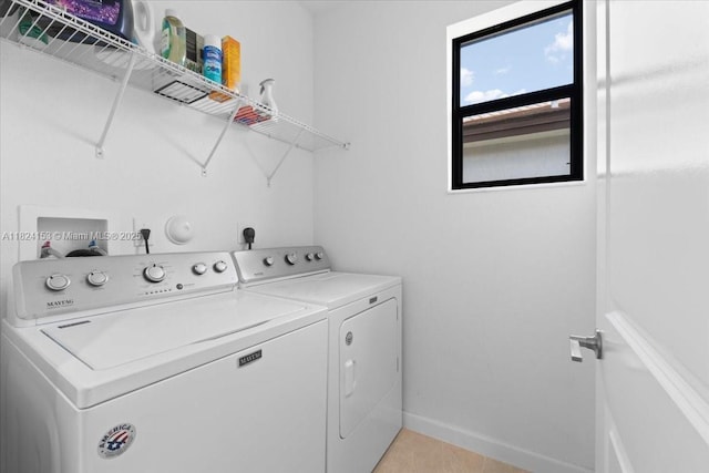 25041 SW 108th Ave, Homestead, FL 33032 - laundry area with washing machine and clothes dryer and light tile patterned floors