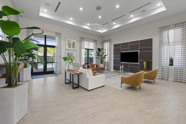 25041 SW 108th Ave, Homestead, FL 33032 - living area featuring a tray ceiling, recessed lighting, and a chandelier