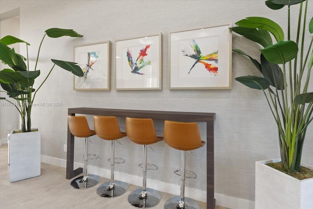 25041 SW 108th Ave, Homestead, FL 33032 - indoor dry bar with baseboards and tile patterned flooring