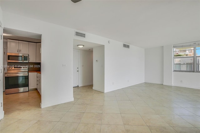 9500 W Bay Harbor Dr Unit 7H, Bay Harbor Islands, FL 33154 - spare room featuring light tile patterned floors