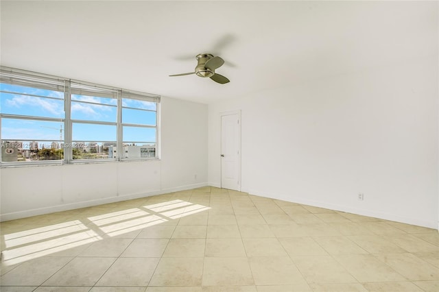 9500 W Bay Harbor Dr Unit 7H, Bay Harbor Islands, FL 33154 - spare room with a ceiling fan and light tile patterned flooring