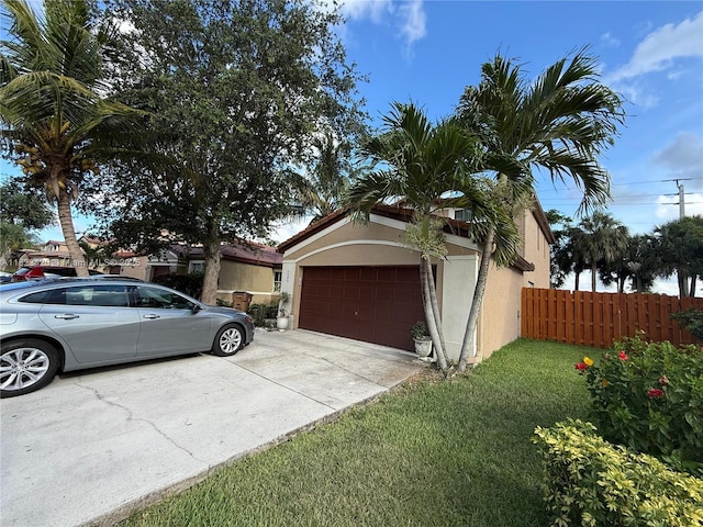 4280 NW 1st Pl, Deerfield Beach, FL 33442 - view of property exterior with stucco siding, concrete driveway, and a garage