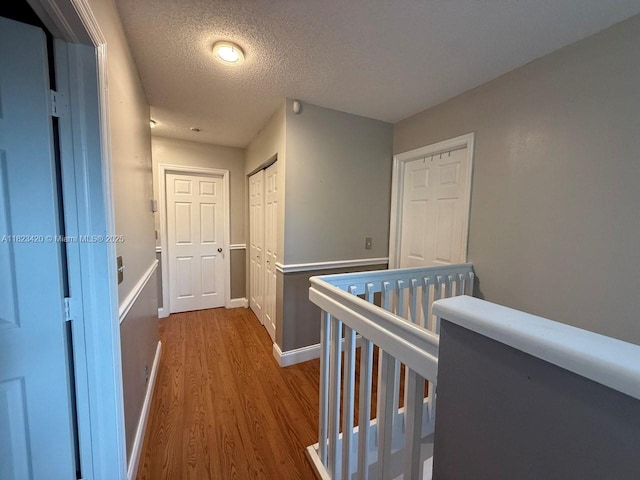 4280 NW 1st Pl, Deerfield Beach, FL 33442 - hallway featuring wood finished floors and a textured ceiling