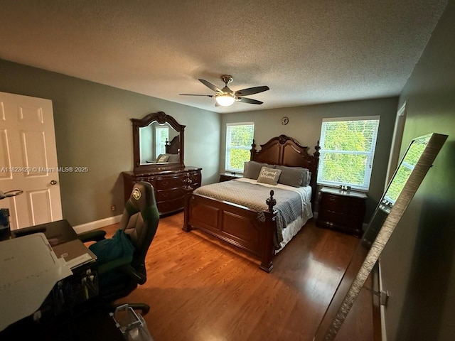 4280 NW 1st Pl, Deerfield Beach, FL 33442 - bedroom featuring a textured ceiling, light wood finished floors, and ceiling fan