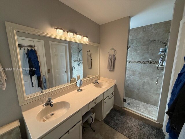 4280 NW 1st Pl, Deerfield Beach, FL 33442 - bathroom with a stall shower, double vanity, tile patterned flooring, and a spacious closet
