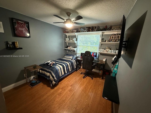 4280 NW 1st Pl, Deerfield Beach, FL 33442 - bedroom with wood finished floors, a ceiling fan, and a textured ceiling