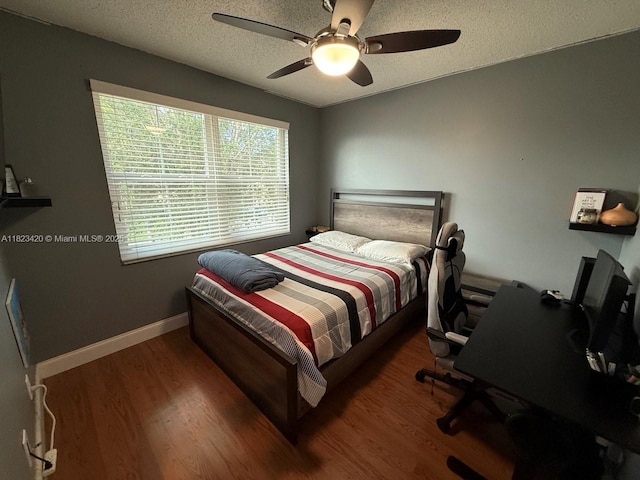 4280 NW 1st Pl, Deerfield Beach, FL 33442 - bedroom featuring wood finished floors, a ceiling fan, a textured ceiling, and a desk
