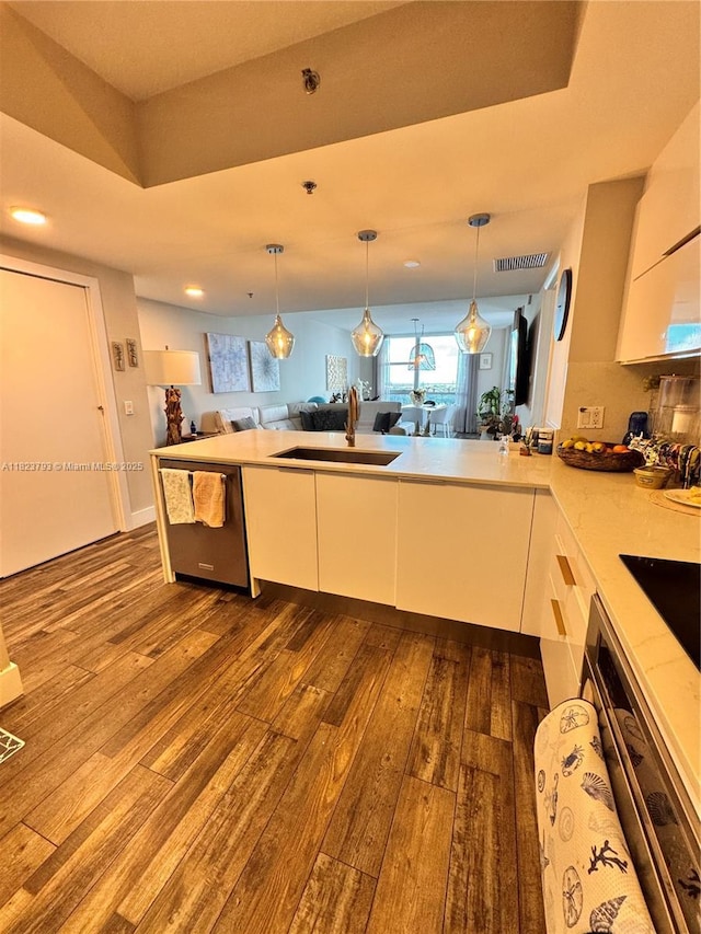 2681 N Flamingo Rd Unit 908S, Sunrise, FL 33323 - kitchen with stainless steel dishwasher, open floor plan, dark wood-type flooring, white cabinetry, and recessed lighting