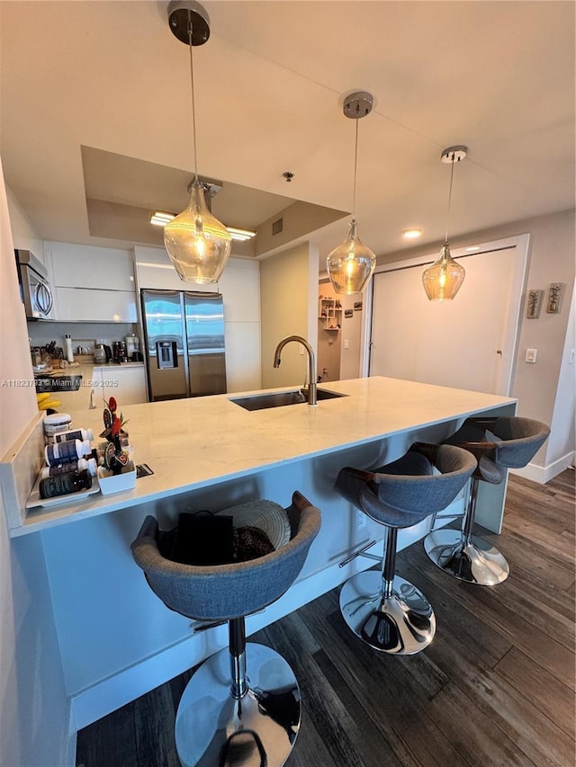 2681 N Flamingo Rd Unit 908S, Sunrise, FL 33323 - kitchen with stainless steel appliances, dark wood finished floors, and white cabinetry