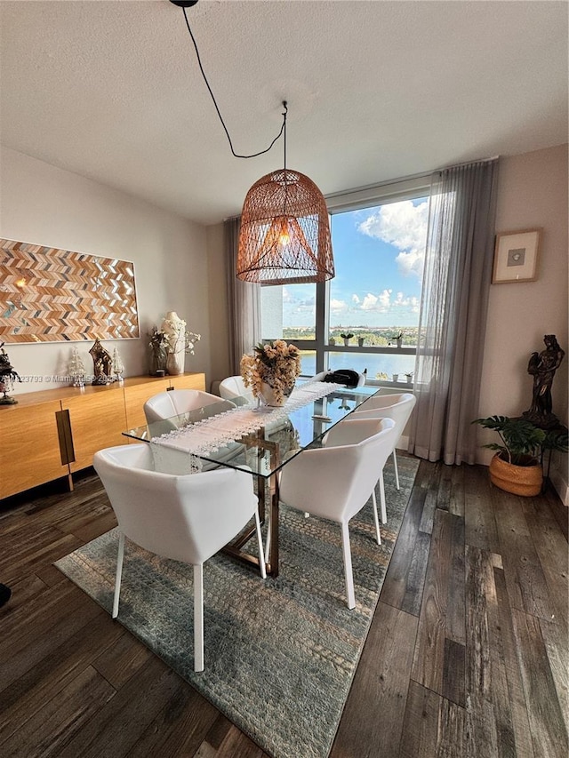 2681 N Flamingo Rd Unit 908S, Sunrise, FL 33323 - dining area with hardwood / wood-style floors, a textured ceiling, and a water view