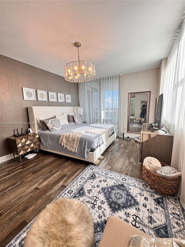 2681 N Flamingo Rd Unit 908S, Sunrise, FL 33323 - bedroom featuring hardwood / wood-style flooring, a chandelier, multiple windows, and a textured ceiling