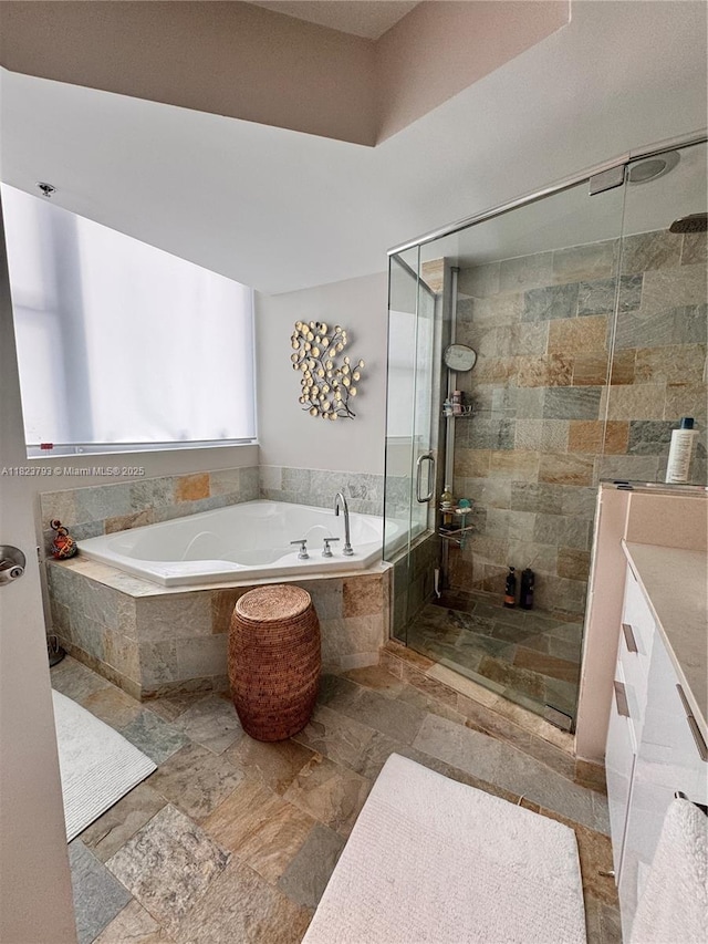 2681 N Flamingo Rd Unit 908S, Sunrise, FL 33323 - full bath featuring a garden tub, stone tile flooring, a shower stall, and vanity