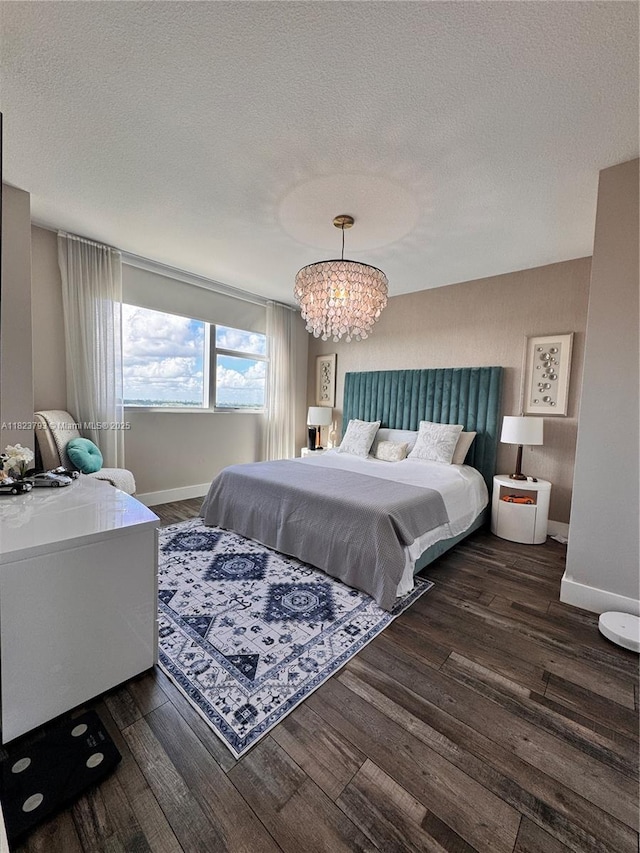 2681 N Flamingo Rd Unit 908S, Sunrise, FL 33323 - bedroom with wood finished floors, a chandelier, and a textured ceiling