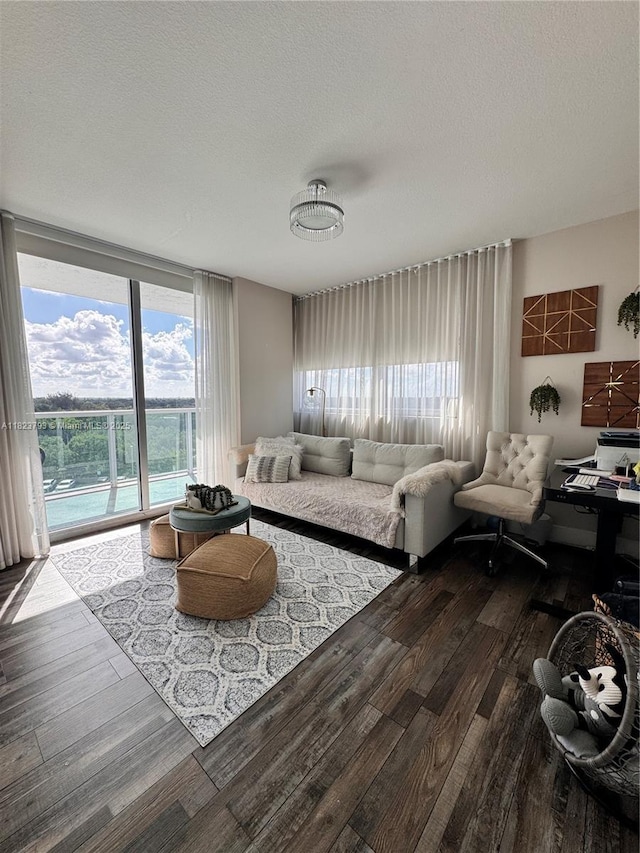 2681 N Flamingo Rd Unit 908S, Sunrise, FL 33323 - living area with wood-type flooring, plenty of natural light, a textured ceiling, and a wall of windows