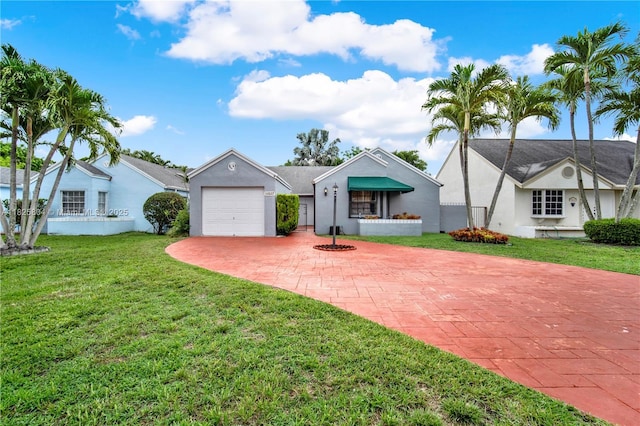 11027 SW 148th Ct, Miami, FL 33196 - single story home with decorative driveway, a garage, a front lawn, and stucco siding