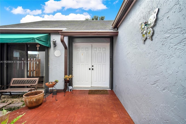 11027 SW 148th Ct, Miami, FL 33196 - doorway to property with stucco siding